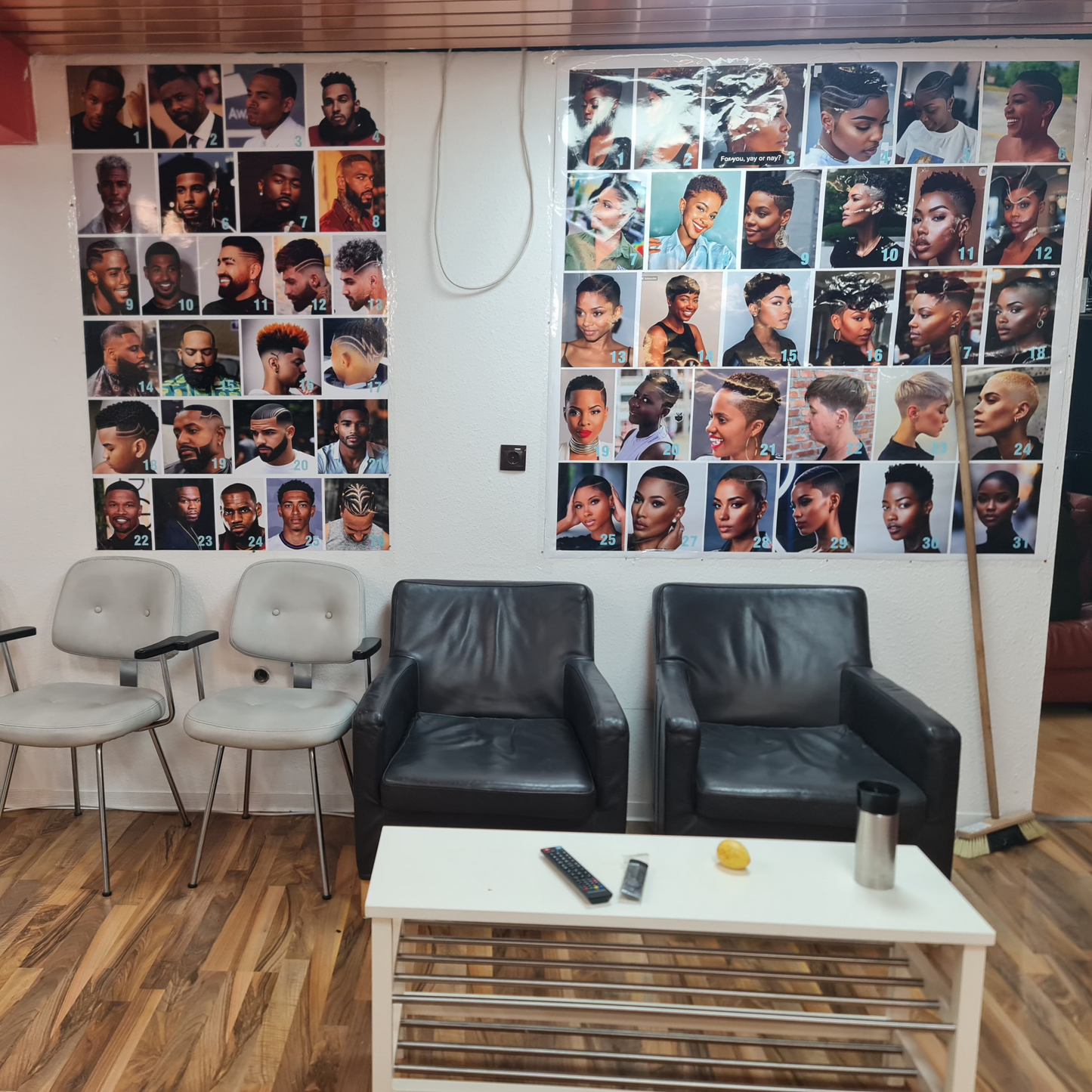 Waiting room with chairs and a wall displaying multiple portraits.