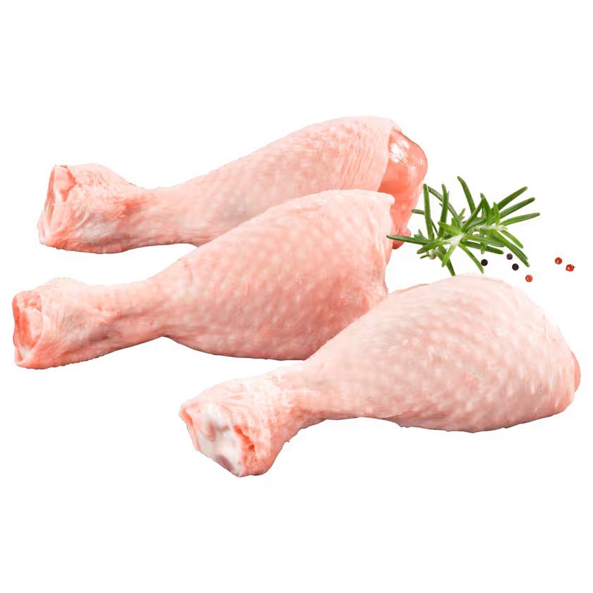 Three raw chicken drumsticks with a sprig of rosemary on a white background