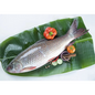 Fish on a banana leaf with vegetables on a white background